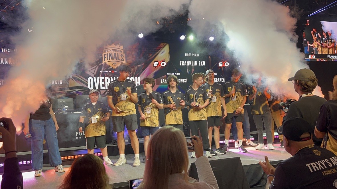 STORM players celebrating on the North American Finals stage